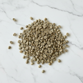Darker green coffee beans on marble