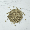Green coffee beans in circular spread pattern