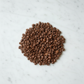 Medium roast coffee beans on marble